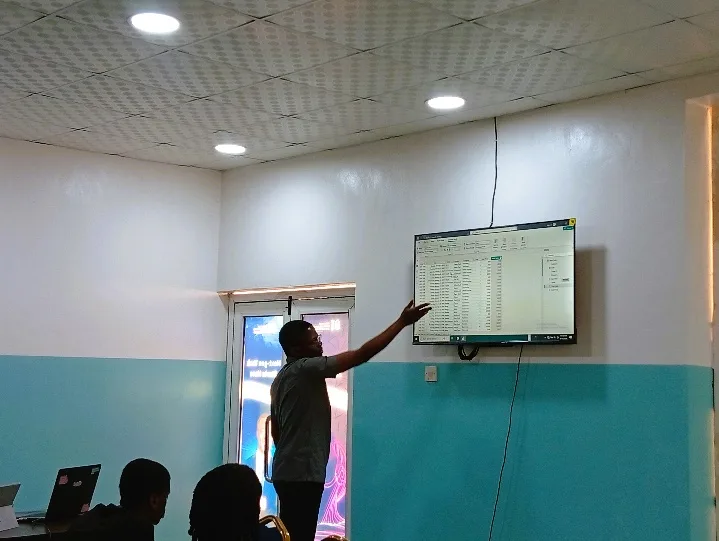 Enoch facilitating a data analytics session in a classroom
